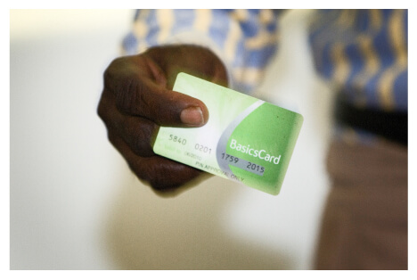 A person holding a Basics Card